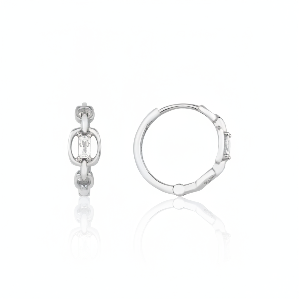 white gold chain-link huggie hoop earrings with baguette stone on white background