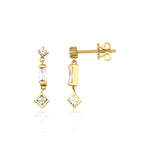 yellow gold articulated drop earrings with baguette and square stones on white background
