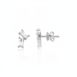 white gold baguette stud earrings on white background