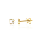 yellow gold baguette and round accent stud earrings on white background