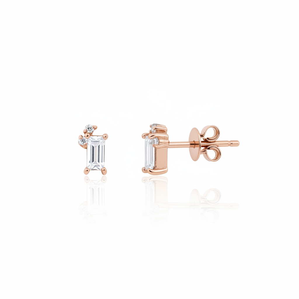 rose gold baguette stud earrings with accent cluster on white background
