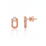 rose gold granulated link stud earrings with baguette stone on white background