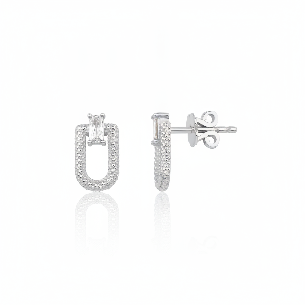 white gold granulated link stud earrings with baguette stone on white background