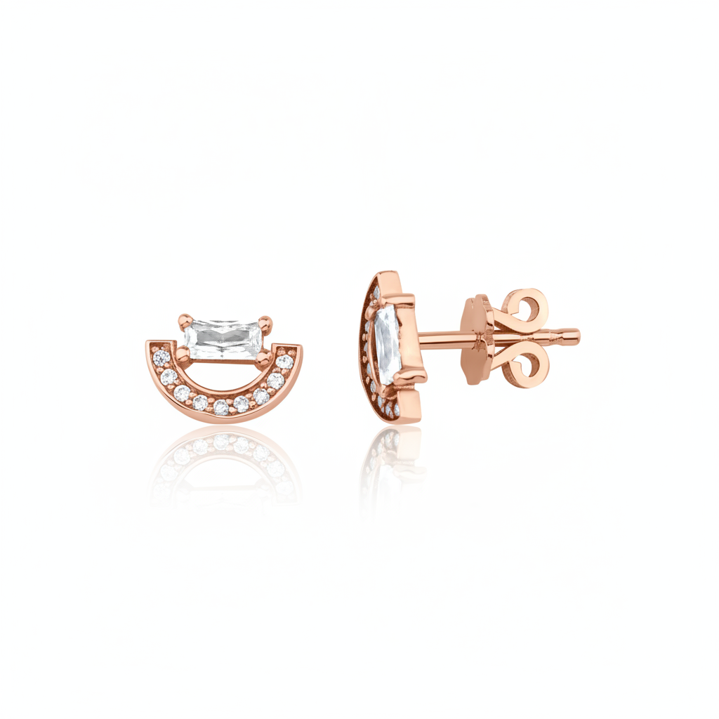 rose gold crescent stud earrings with baguette stone on white background
