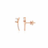 rose gold curved baguette stud earrings on white background