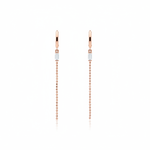 rose gold huggie hoop earrings with baguette stone and beaded chain drop on white background