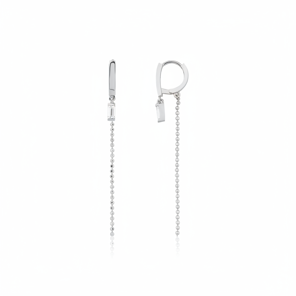 white gold huggie hoop earrings with baguette stone and beaded chain drop on white background