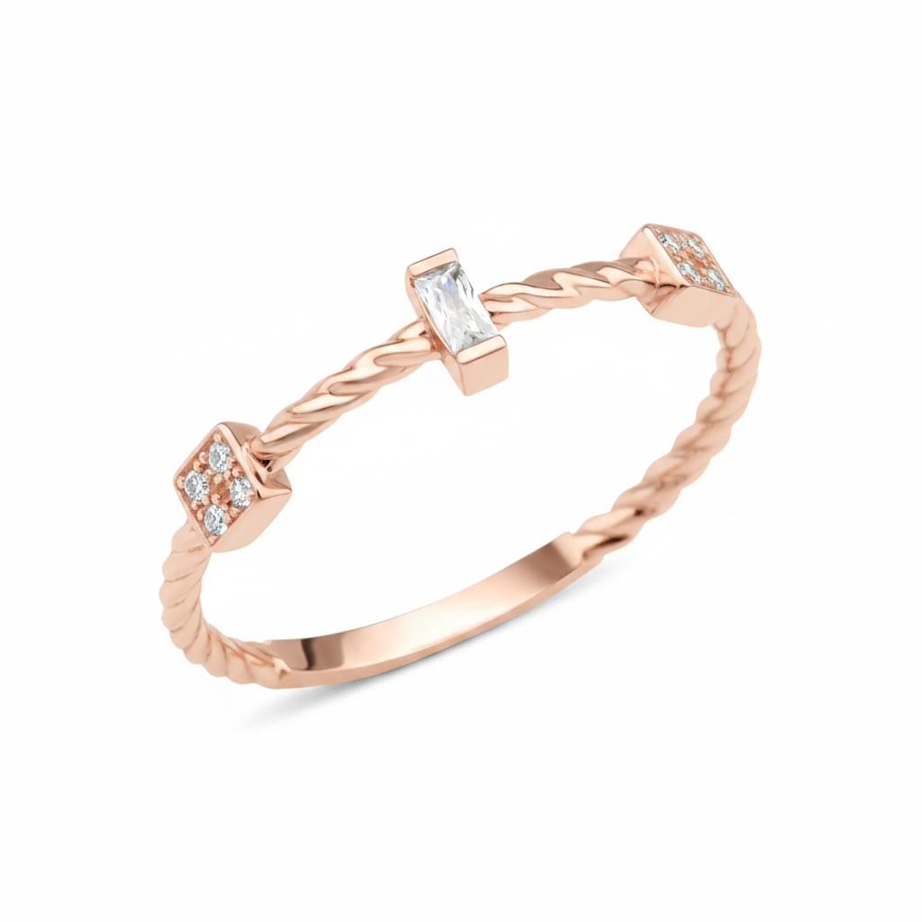 rose gold twisted ring with baguette and square cluster stones on white background