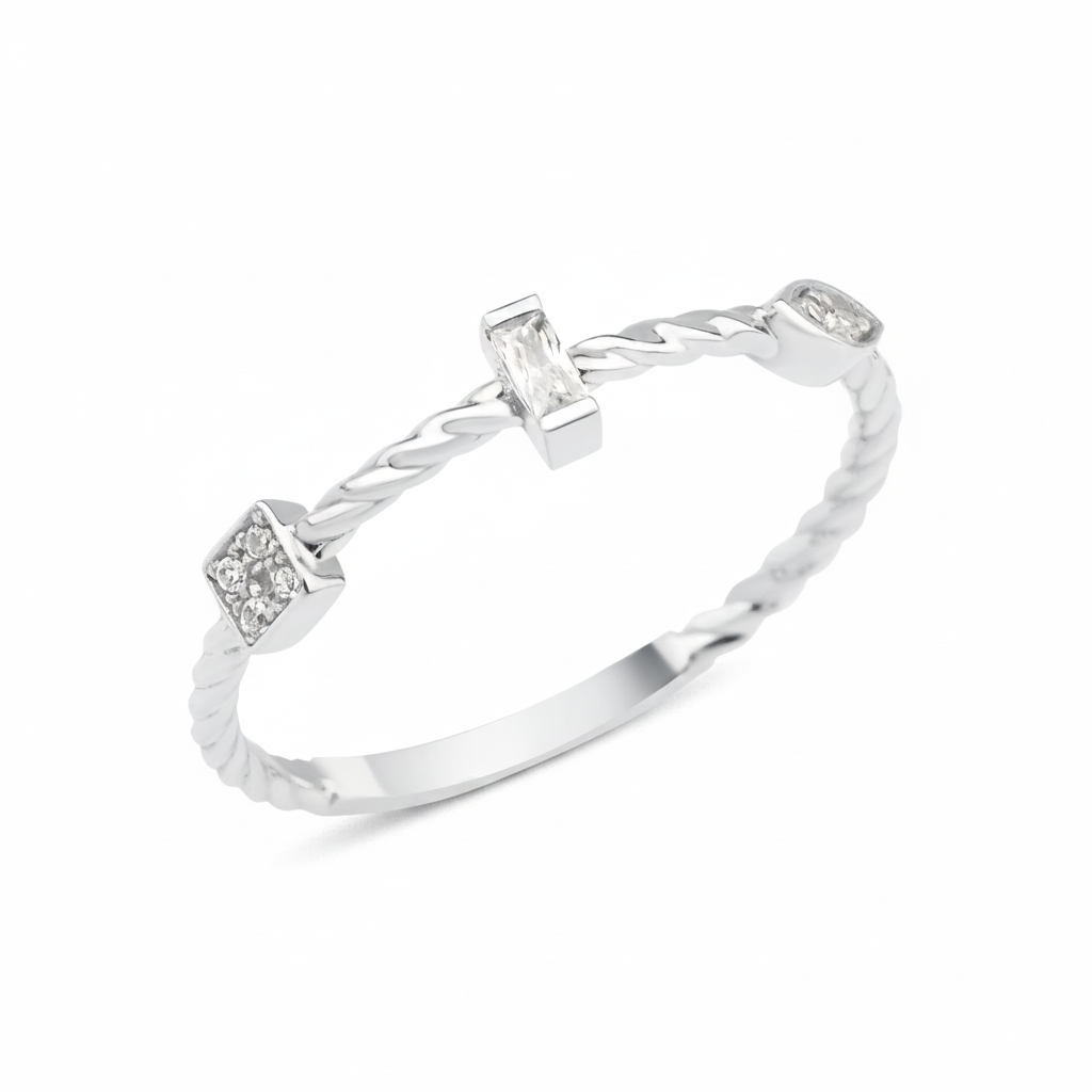 white gold twisted ring with baguette and square cluster stones on white background