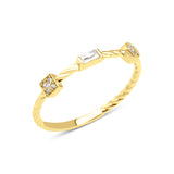 yellow gold twisted ring with square, baguette, and bezel stones on white background