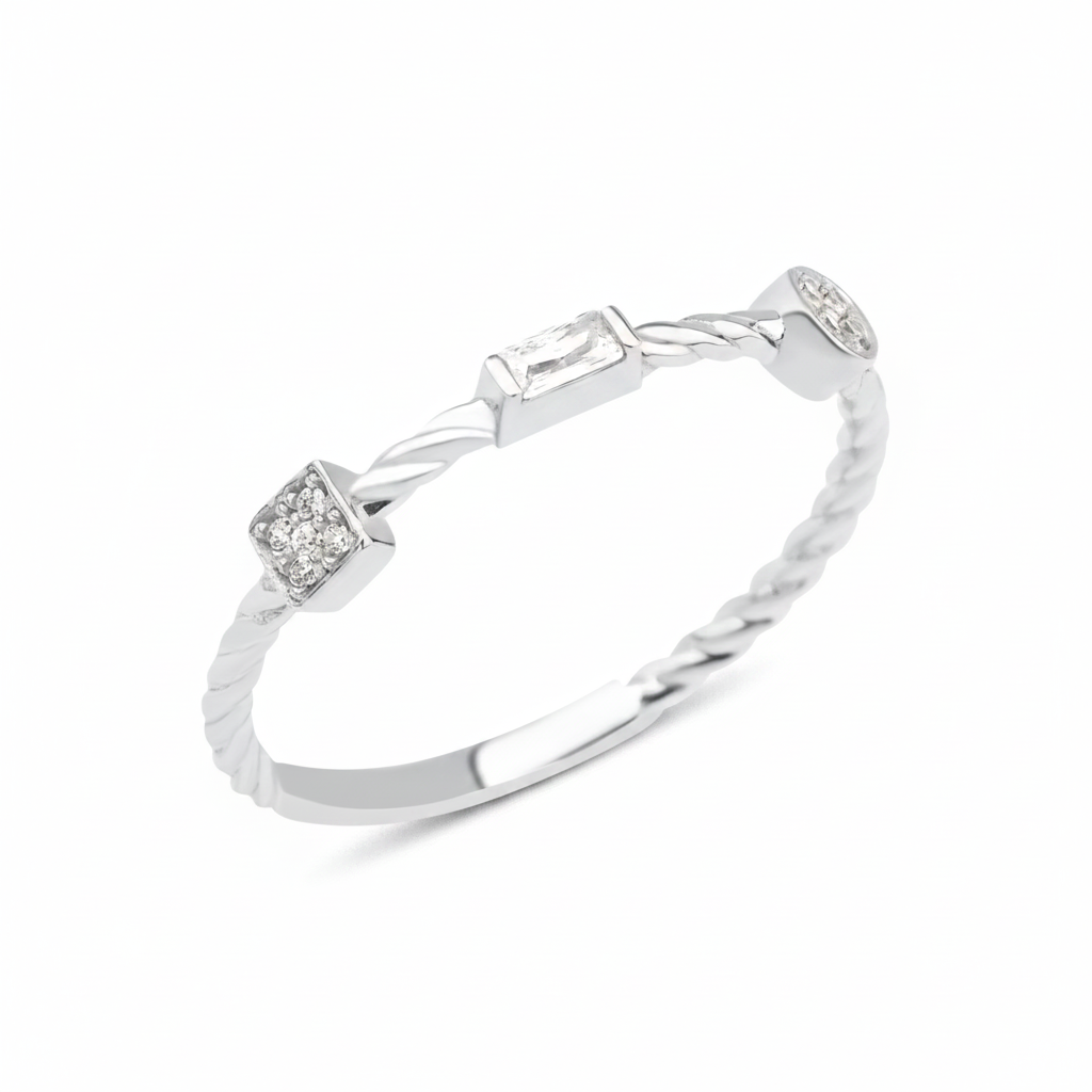 white gold twisted ring with square, baguette, and bezel stones on white background