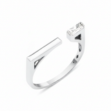 white gold open ring with polished bar and baguette stone on white background
