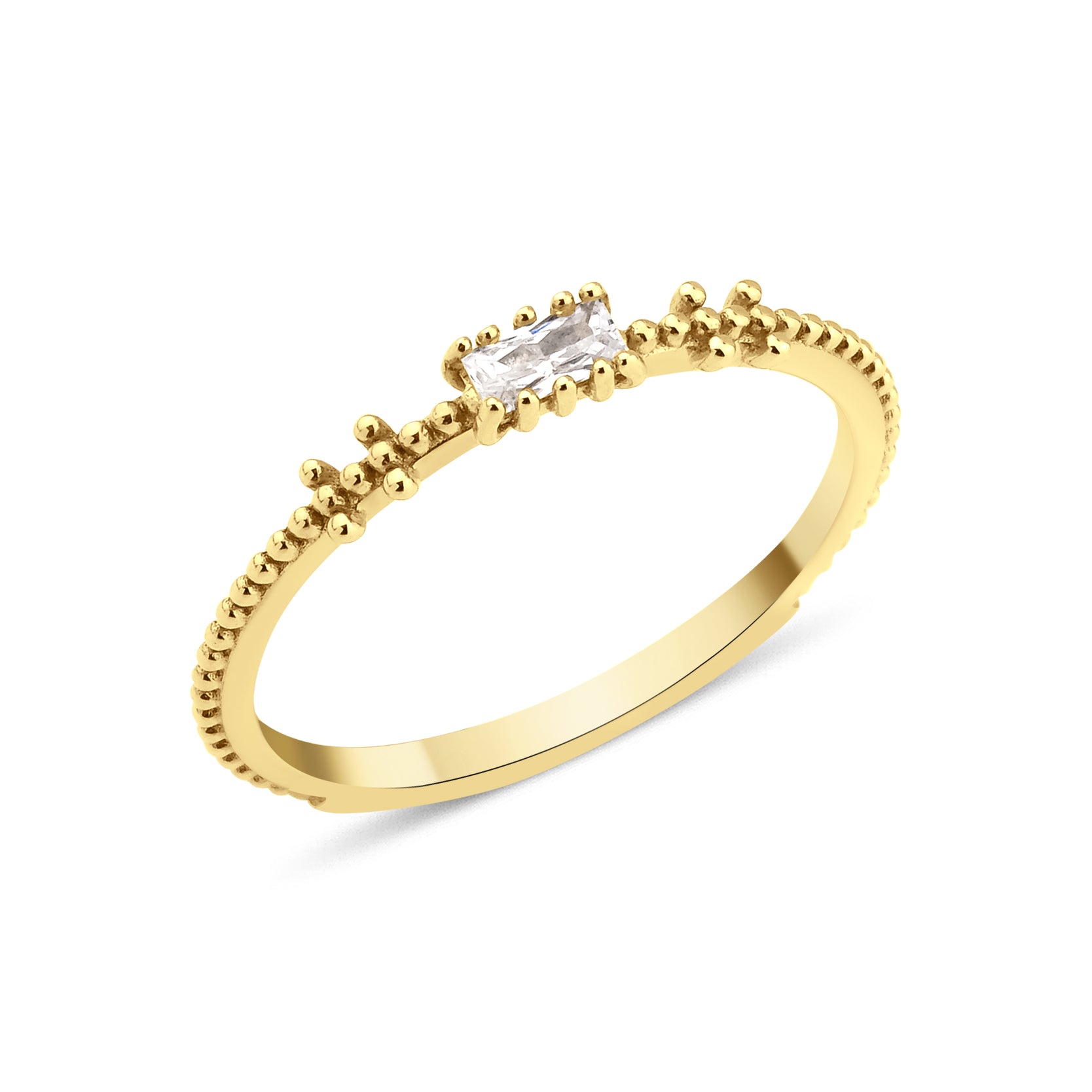 yellow gold beaded band ring with baguette stone on white background