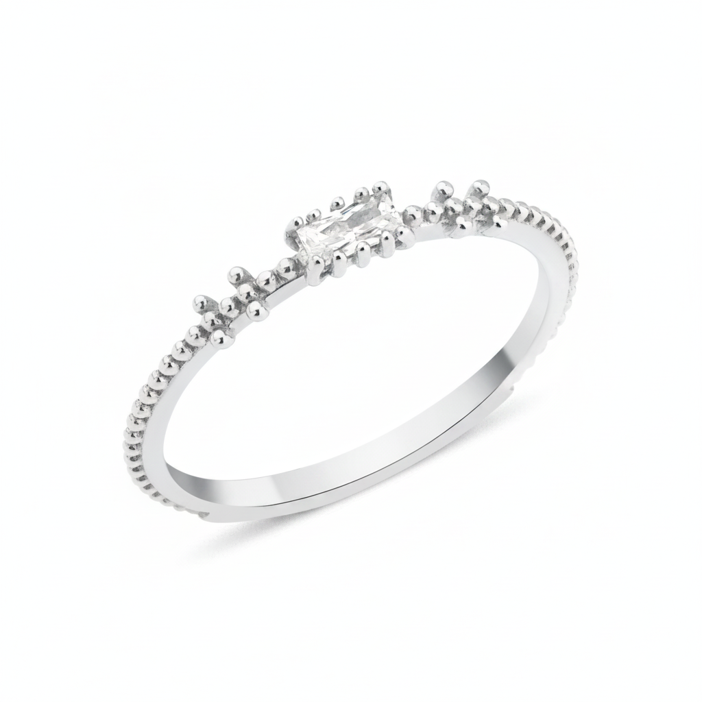 white gold beaded band ring with baguette stone on white background