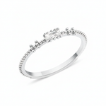 white gold beaded band ring with baguette stone on white background