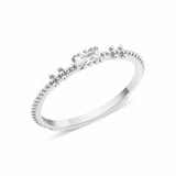 white gold beaded band ring with baguette stone on white background
