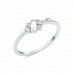 white gold ring with baguette stone and round accent cluster on white background