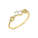yellow gold beaded ring with baguette and round stones on white background