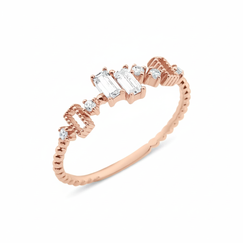 rose gold beaded ring with baguette and round stones on white background
