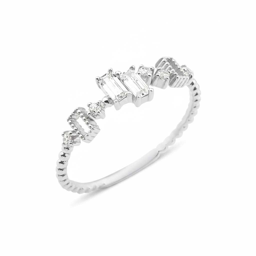 white gold beaded ring with baguette and round stones on white background