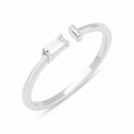 white gold open ring with baguette stone and smooth bar on white background