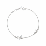 white gold butterfly charm bracelet on white background