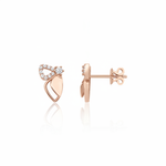 rose gold wing stud earrings with pave stones on white background