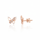 rose gold butterfly stud earrings with pave clusters on white background