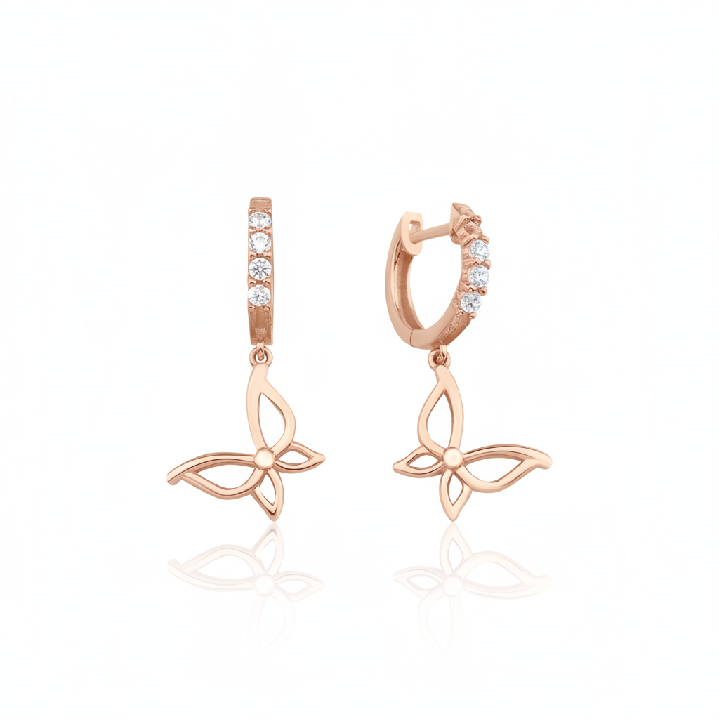 rose gold hoop earrings with butterfly charms on white background