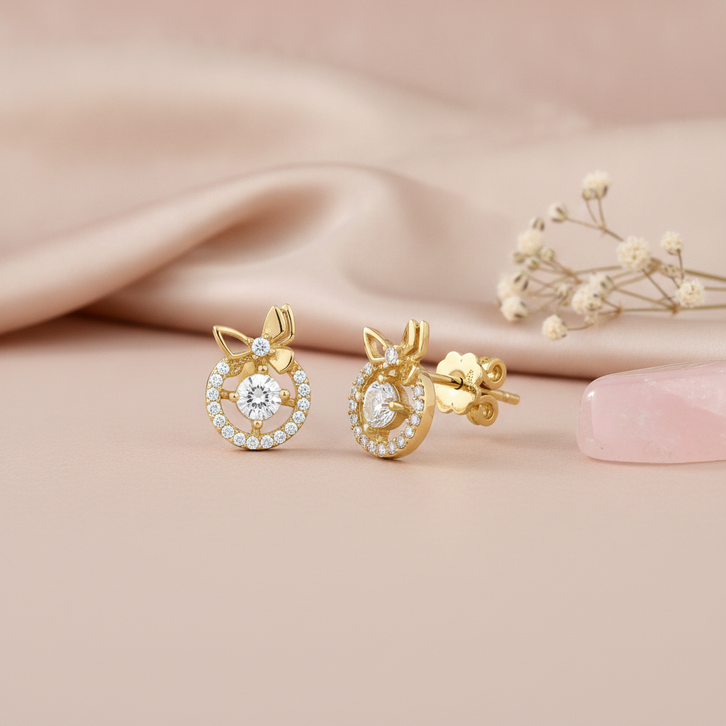 gold ribbon halo stud earrings with clear stones on pink satin with dried flowers and rose quartz