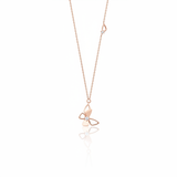 rose gold stylized butterfly pendant necklace on white background