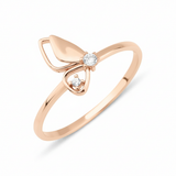 rose gold butterfly wing ring on white background