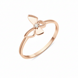 rose gold butterfly ring with a center clear stone on a white background