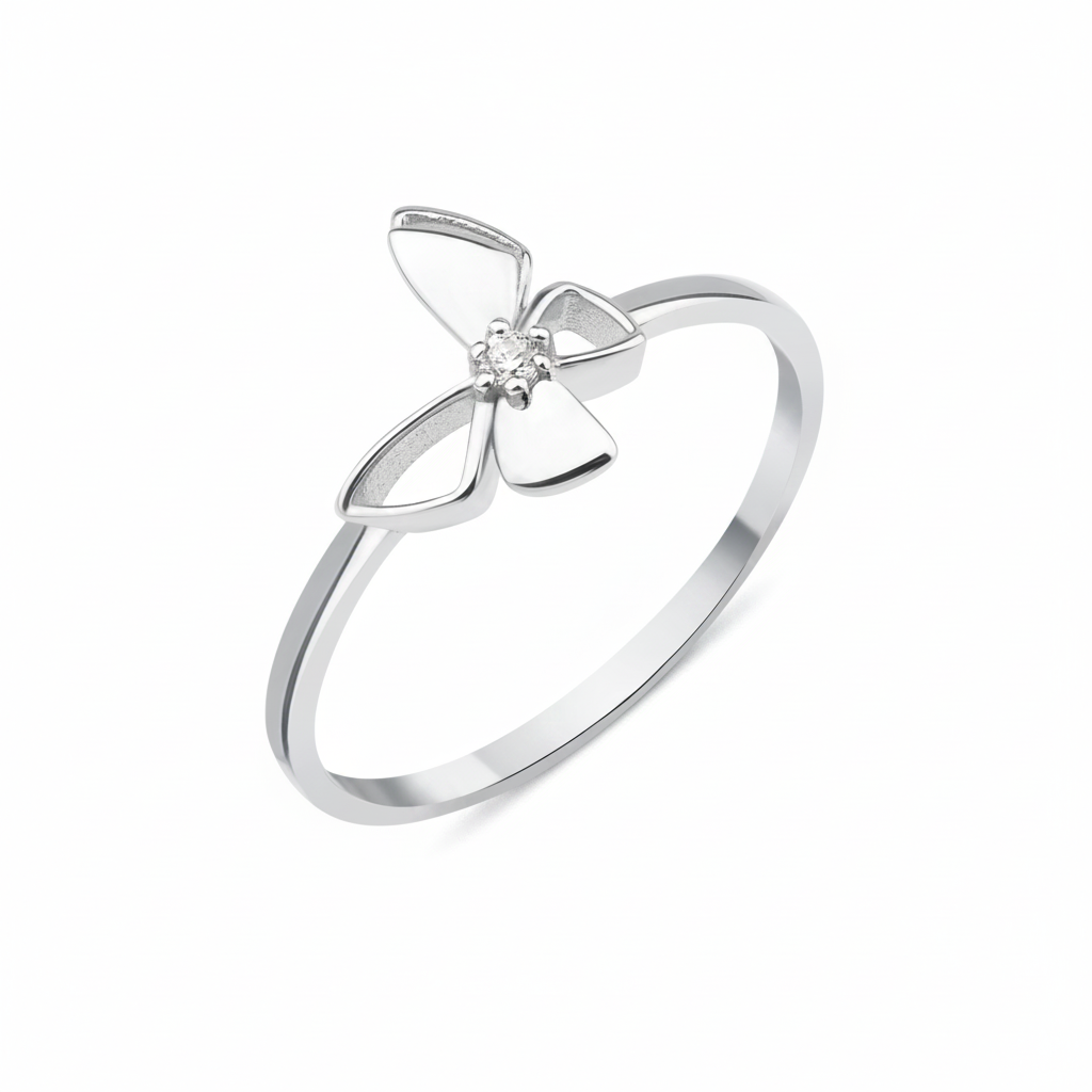white gold butterfly ring with a center clear stone on a white background