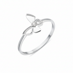 white gold butterfly ring with a center clear stone on a white background