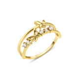 yellow gold double-band ring with two butterfly motifs on a white background