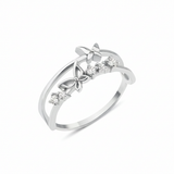 white gold double-band ring with two butterfly motifs on a white background