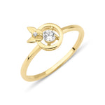yellow gold halo ring with a butterfly accent on a white background