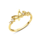 yellow gold openwork butterfly band ring on a white background