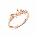 rose gold openwork butterfly band ring on a white background