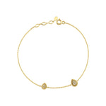 yellow gold teardrop station bracelet on white background