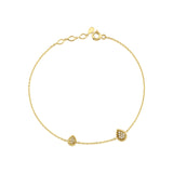 yellow gold teardrop station bracelet on white background