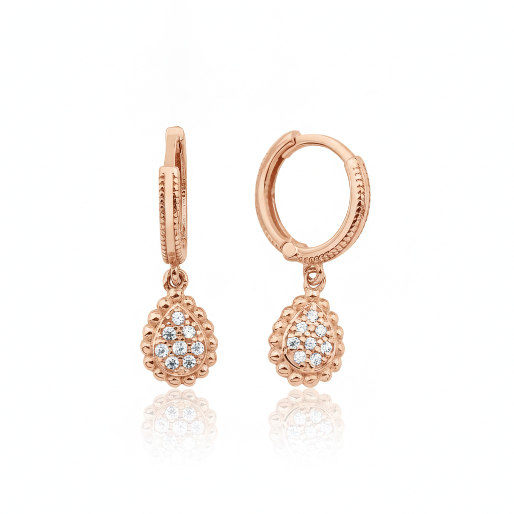 rose gold huggie hoops with teardrop drop on white background