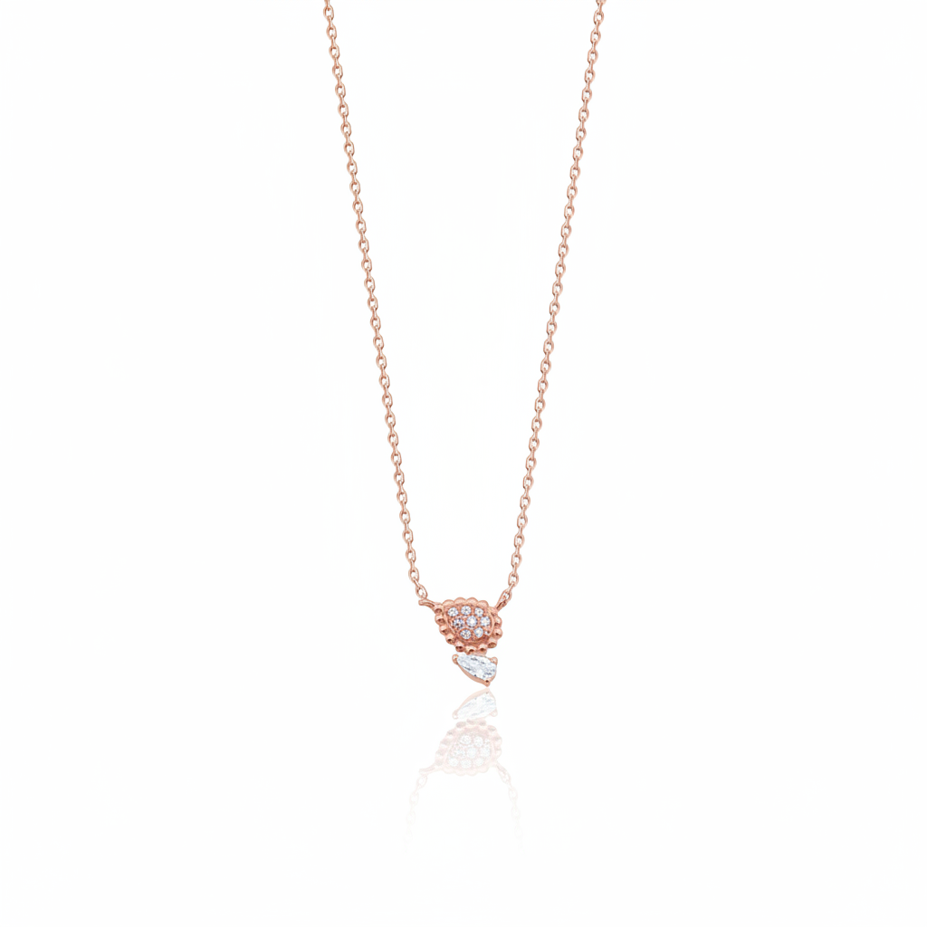 rose gold beaded teardrop and pear-cut stone necklace on white background