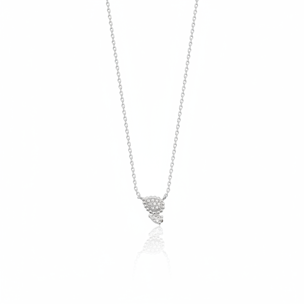 white gold beaded teardrop and pear-cut stone necklace on white background
