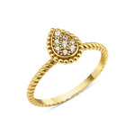yellow gold teardrop ring on twisted band on white background