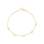 yellow gold faceted nugget station bracelet on a white background