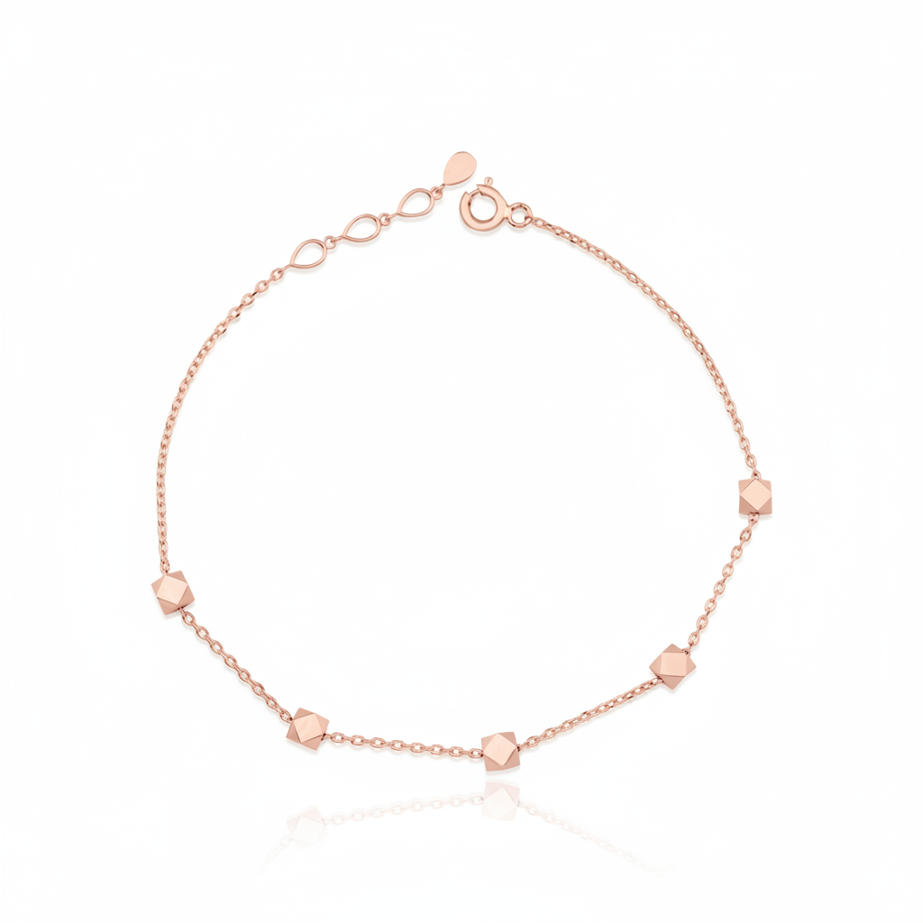 rose gold faceted nugget station bracelet on a white background