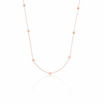 rose gold faceted nugget station necklace on a white background