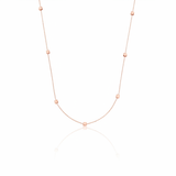 rose gold faceted nugget station necklace on a white background
